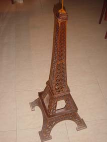 Scroll saw fretwork wooden model of the Eiffel Tower on the floor